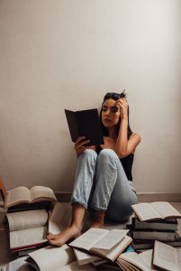 woman reading Portuguese books